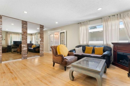 87 Hillgrove Drive Sw, Calgary, AB - Indoor Photo Showing Living Room With Fireplace