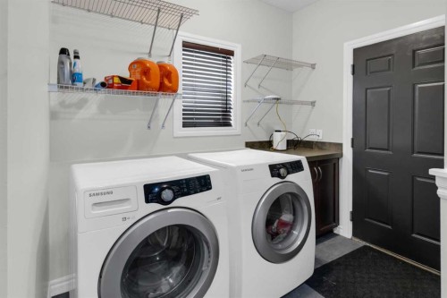 180 Kincora Drive Nw, Calgary, AB - Indoor Photo Showing Laundry Room