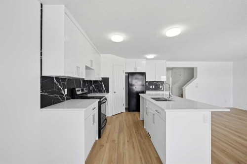 165 Saddlecrest Way Ne, Calgary, AB - Indoor Photo Showing Kitchen With Double Sink