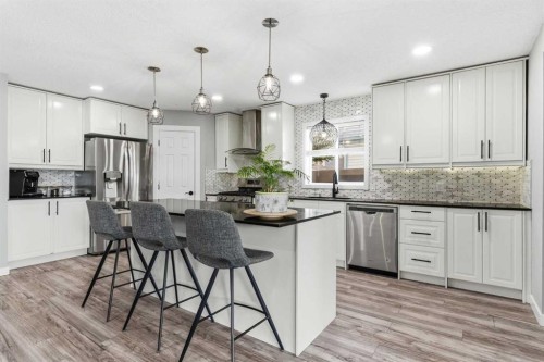 23 Prestwick Green Se, Calgary, AB - Indoor Photo Showing Kitchen With Upgraded Kitchen