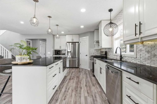 23 Prestwick Green Se, Calgary, AB - Indoor Photo Showing Kitchen With Upgraded Kitchen