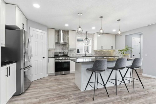 23 Prestwick Green Se, Calgary, AB - Indoor Photo Showing Kitchen With Upgraded Kitchen