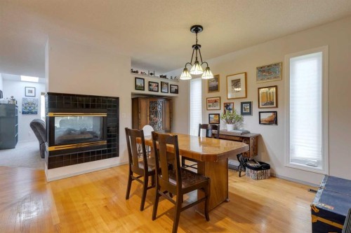 926 19 Avenue Nw, Calgary, AB - Indoor Photo Showing Dining Room With Fireplace
