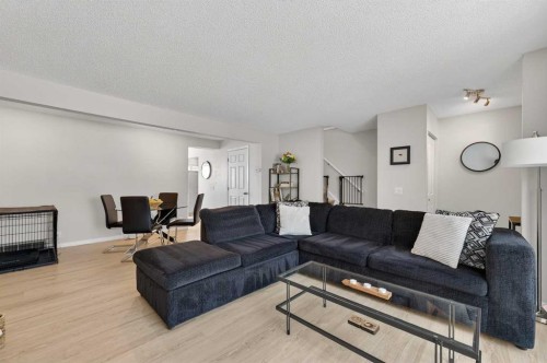 81 Queen Anne Close Se, Calgary, AB - Indoor Photo Showing Living Room