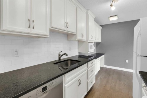 210-1602 11 Avenue Sw, Calgary, AB - Indoor Photo Showing Kitchen With Upgraded Kitchen