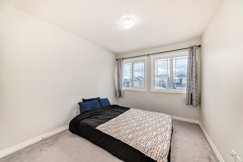 163 Evanscrest Way Nw, Calgary, AB - Indoor Photo Showing Bedroom