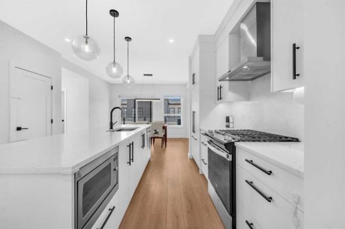 252-7820 Spring Willow Drive Sw, Calgary, AB - Indoor Photo Showing Kitchen With Upgraded Kitchen