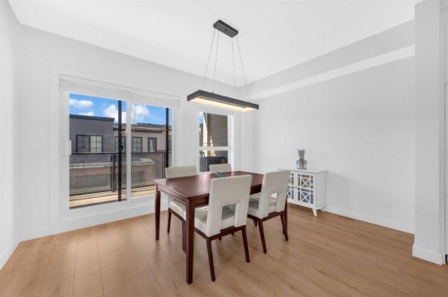 252-7820 Spring Willow Drive Sw, Calgary, AB - Indoor Photo Showing Dining Room