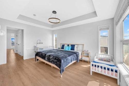 252-7820 Spring Willow Drive Sw, Calgary, AB - Indoor Photo Showing Bedroom