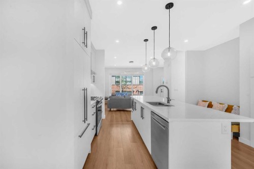 252-7820 Spring Willow Drive Sw, Calgary, AB - Indoor Photo Showing Kitchen With Double Sink With Upgraded Kitchen