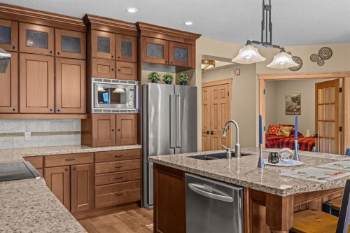 202-3 Aspen Glen, Canmore, AB - Indoor Photo Showing Kitchen With Double Sink