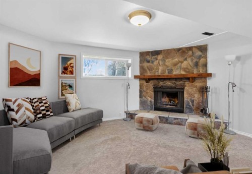 124 Lynnbrook Road Se, Calgary, AB - Indoor Photo Showing Living Room With Fireplace