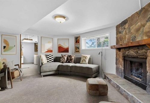 124 Lynnbrook Road Se, Calgary, AB - Indoor Photo Showing Living Room With Fireplace