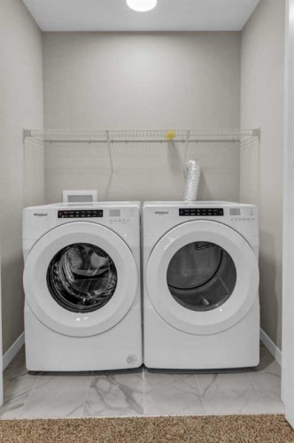 249 Aquila Drive Nw, Calgary, AB - Indoor Photo Showing Laundry Room