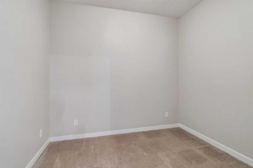 9205-101 Sunset Drive, Cochrane, AB - Indoor Photo Showing Other Room