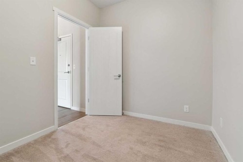 9205-101 Sunset Drive, Cochrane, AB - Indoor Photo Showing Other Room