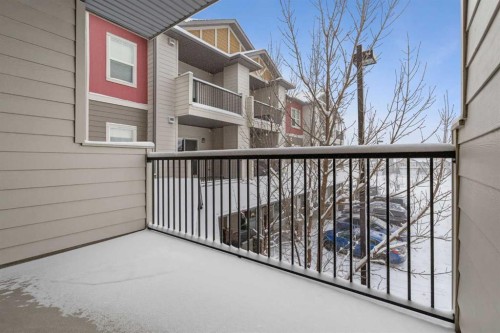 9205-101 Sunset Drive, Cochrane, AB - Outdoor With Balcony With Exterior
