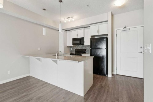9205-101 Sunset Drive, Cochrane, AB - Indoor Photo Showing Kitchen