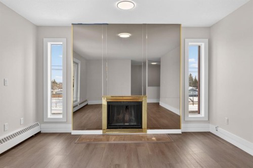315-335 Garry Crescent Ne, Calgary, AB - Indoor With Fireplace