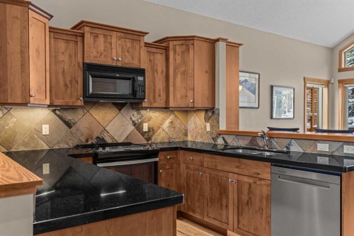 147 Hubman Landing, Canmore, AB - Indoor Photo Showing Kitchen With Double Sink