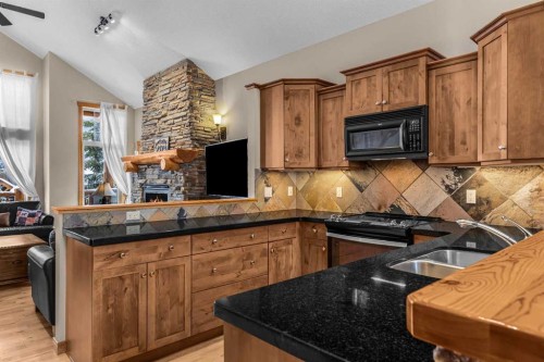 147 Hubman Landing, Canmore, AB - Indoor Photo Showing Kitchen With Double Sink