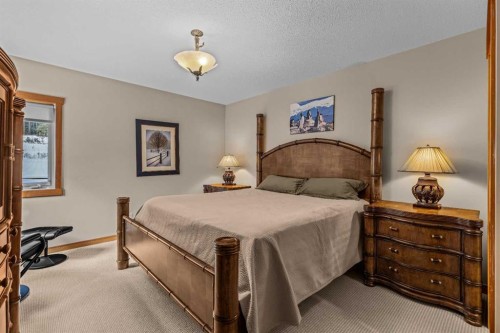 147 Hubman Landing, Canmore, AB - Indoor Photo Showing Bedroom