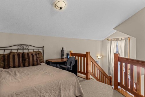 147 Hubman Landing, Canmore, AB - Indoor Photo Showing Bedroom
