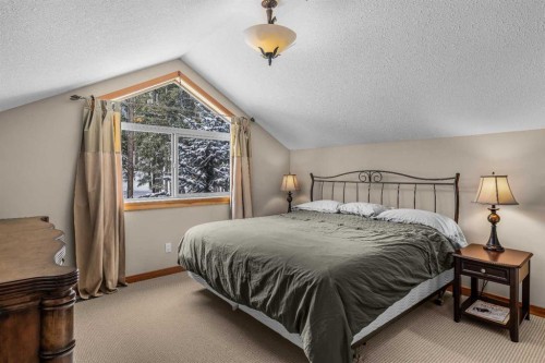 147 Hubman Landing, Canmore, AB - Indoor Photo Showing Bedroom