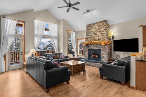 147 Hubman Landing, Canmore, AB - Indoor Photo Showing Living Room With Fireplace