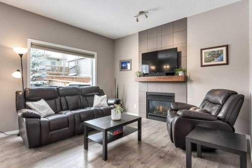 105 Wildrose Green, Strathmore, AB - Indoor Photo Showing Living Room With Fireplace