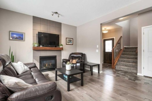 105 Wildrose Green, Strathmore, AB - Indoor Photo Showing Living Room With Fireplace