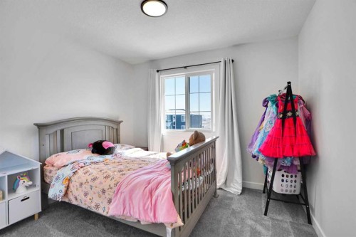 188 Brander Avenue, Langdon, AB - Indoor Photo Showing Bedroom