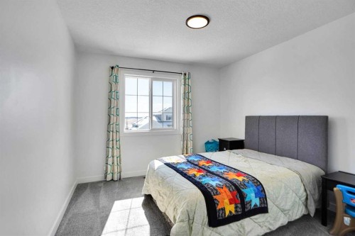 188 Brander Avenue, Langdon, AB - Indoor Photo Showing Bedroom
