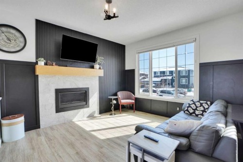 188 Brander Avenue, Langdon, AB - Indoor Photo Showing Living Room With Fireplace
