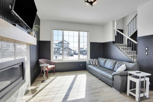 188 Brander Avenue, Langdon, AB - Indoor Photo Showing Living Room With Fireplace