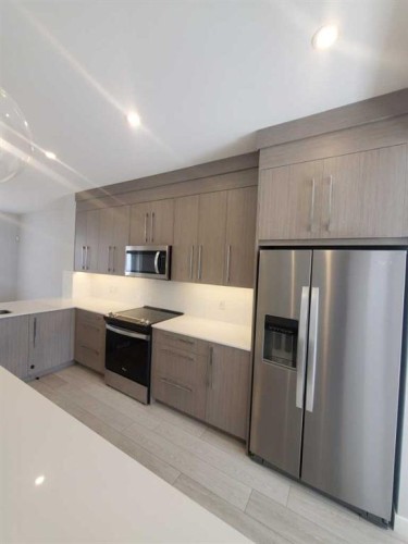 1045 West Lakeview Drive, Chestermere, AB - Indoor Photo Showing Kitchen With Stainless Steel Kitchen