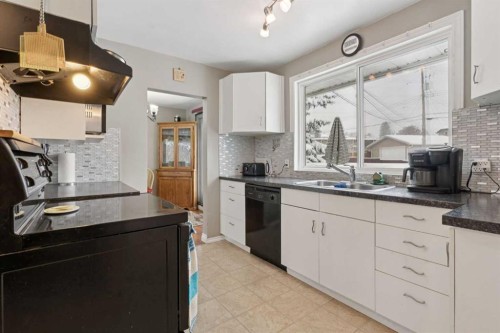 12 Westwood Crescent Sw, Calgary, AB - Indoor Photo Showing Kitchen With Double Sink