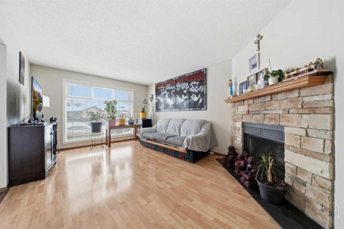 488 Templevale Drive Ne, Calgary, AB - Indoor Photo Showing Living Room With Fireplace