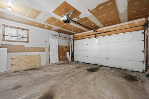 23 Millbank Drive Sw, Calgary, AB - Indoor Photo Showing Garage
