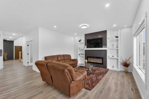 67 Lakes Estates Circle, Strathmore, AB - Indoor Photo Showing Living Room With Fireplace