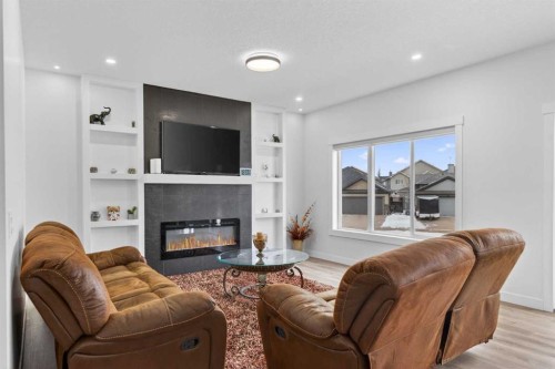 67 Lakes Estates Circle, Strathmore, AB - Indoor Photo Showing Living Room With Fireplace