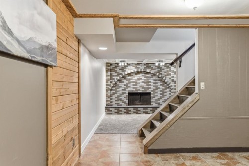 1315 Lake Michigan Crescent Se, Calgary, AB - Indoor Photo Showing Other Room With Fireplace