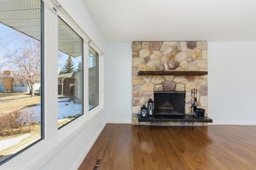 1315 Lake Michigan Crescent Se, Calgary, AB - Indoor Photo Showing Living Room With Fireplace