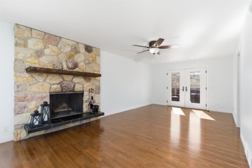 1315 Lake Michigan Crescent Se, Calgary, AB - Indoor Photo Showing Living Room With Fireplace