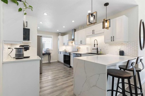 48 Cedargrove Road Sw, Calgary, AB - Indoor Photo Showing Kitchen With Upgraded Kitchen