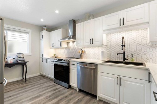 48 Cedargrove Road Sw, Calgary, AB - Indoor Photo Showing Kitchen With Stainless Steel Kitchen With Upgraded Kitchen