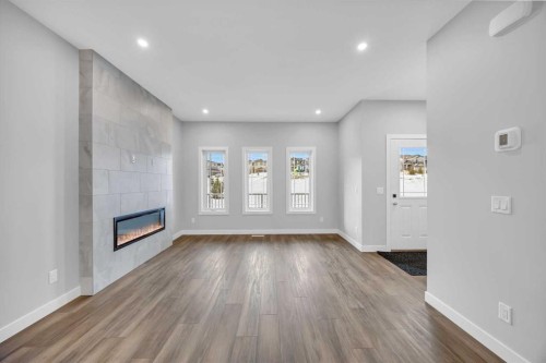 10 Versant Path Sw, Calgary, AB - Indoor With Fireplace