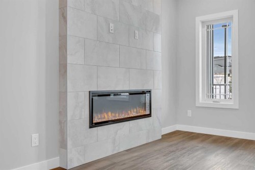 10 Versant Path Sw, Calgary, AB - Indoor With Fireplace