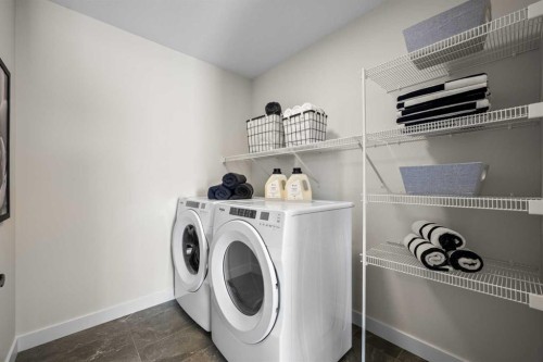 203 Huxland Path Ne, Calgary, AB - Indoor Photo Showing Laundry Room