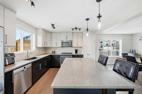 157 Fireside Circle Nw, Cochrane, AB - Indoor Photo Showing Kitchen With Double Sink With Upgraded Kitchen